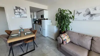 a living room with a couch and a table at Aladdin's Sky in Zandvoort