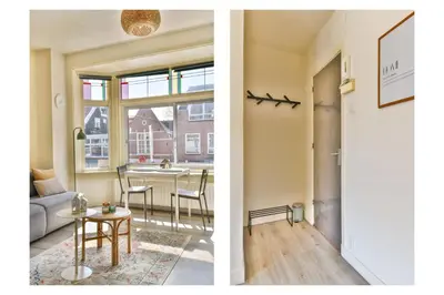 a living room and a dining room with a window at Studio la Riet in Alkmaar