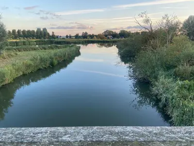 a view of a river from a bridge at Bed and Breakfast Het schapenlandje in Waarland