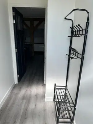 a room with a mirror and a stair case at Golf course around the corner! in Nieuwveen