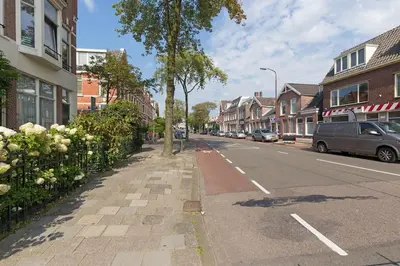 a city street with cars parked on the side of the road at Authentic townhouse Alkmaar in Alkmaar