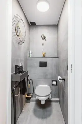 a bathroom with a white toilet and a sink at B Center charming room on the canal in Amsterdam