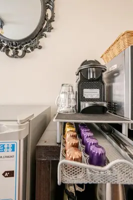 a shelf with a blender and some donuts on it at SM Center located room on the canal in Amsterdam