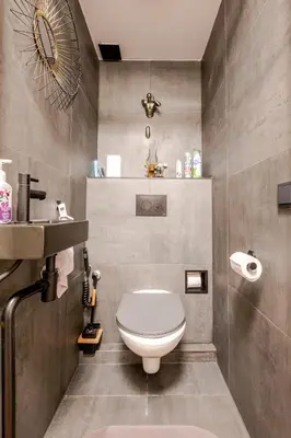 a bathroom with a toilet and a sink at SM Center located room on the canal in Amsterdam