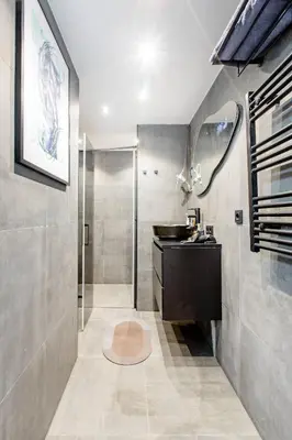a bathroom with a sink and a shower at SM Center located room on the canal in Amsterdam