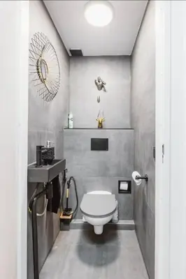 a bathroom with a white toilet and a sink at SM Center located room on the canal in Amsterdam