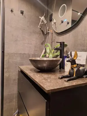 a bathroom with a sink and a bowl on a counter at SM Center located room on the canal in Amsterdam