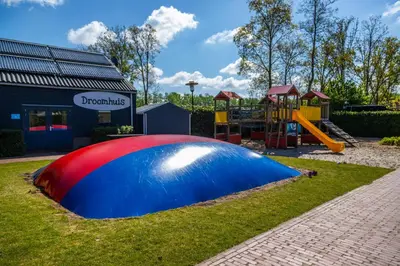 a playground with a red white and blue play structure at EuroParcs Buitenhuizen in Velsen-Zuid