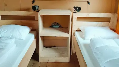 two bunk beds sitting next to each other in a room at EuroParcs Molengroet in Noord-Scharwoude