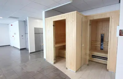 a room with wooden cupboards in a building at EuroParcs Spaarnwoude in Halfweg