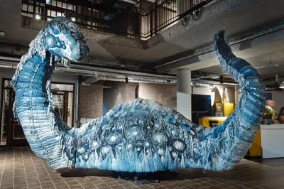 a blue glass whale sculpture in a room at De Groene Afslag Hotel in Bussum