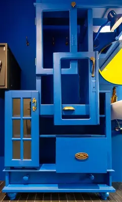 a blue dresser with a glass door in a room at De Groene Afslag Hotel in Bussum
