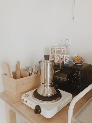 a blender sitting on a counter next to a microwave at Unique Tiny House close to Ams Airport with Hottub in Rijsenhout