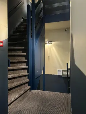 a staircase in a building with blue walls at Hotel Zeedijk City Centre in Amsterdam
