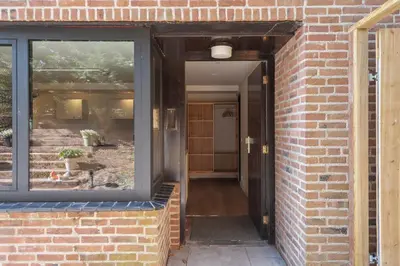 an entrance to a brick building with a glass door at Blissea in Zandvoort