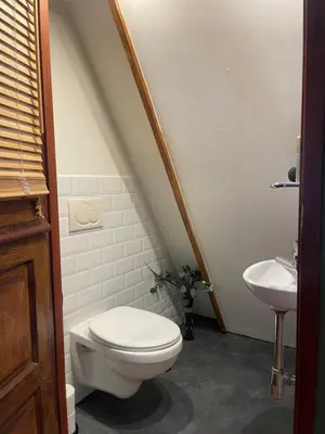a bathroom with a toilet and a sink at Sandy soul escape in Zandvoort