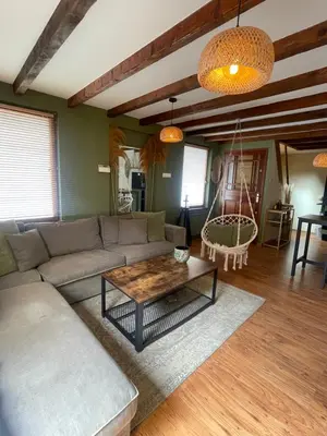 a living room with a couch and a coffee table at Sandy soul escape in Zandvoort