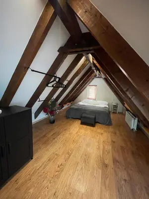 a bedroom with a bed in a attic at Sandy soul escape in Zandvoort