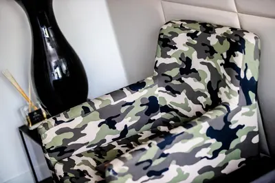 a camo seat in a camo truck at Amsterdam-Houseboat-Amstel in Amsterdam