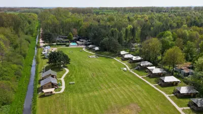 an aerial view of a farm with many tents at Trio Lodge in Zeewolde