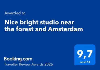 a blue sign with the text nice bright studio near the forest and american at Nice bright studio near the forest and Amsterdam in Baarn