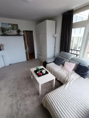 a living room with a couch and a coffee table at Near Centrum in Amsterdam
