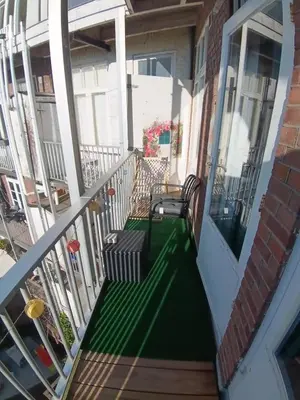 a porch with two benches on a balcony at Near Centrum in Amsterdam