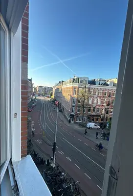 a view of a street from a window of a building at Cozy Home in The Oude Pijp in Amsterdam