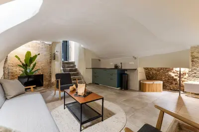 a living room with a couch and a table at Unique underground hotel in Utrecht city center in Utrecht