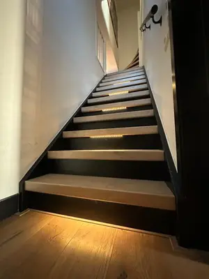 a staircase in a building with wooden floors at Catwijck Loft in Katwijk aan Zee