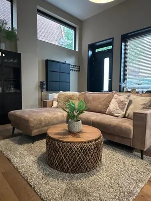 a living room with a couch and a coffee table at Catwijck Loft in Katwijk aan Zee
