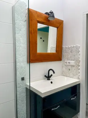 a bathroom with a sink and a mirror at The Kingfisher near beach and dunes Hargen and Schoorl in Dirkshorn