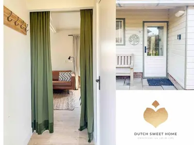 a front door of a house with green curtains at The Soultree - Stylish nature cottage near Schoorl dunes & Bergen beach in Warmenhuizen