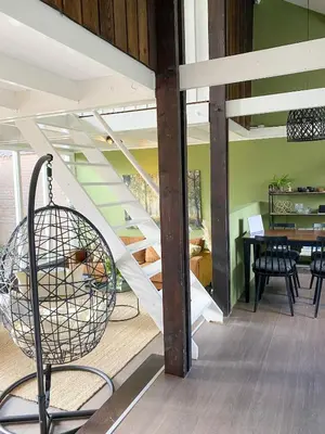 a staircase in a house with a swing at The Highlander- Stylish Hideaway near Beach & Forest Schoorl and Bergen- Dogs Welcome in Warmenhuizen