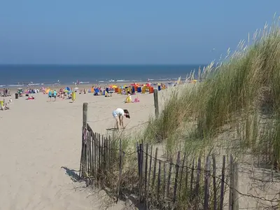 a beach with a lot of people on it at Holiday Home in Noordwijkerhout by Forest & Lake in Noordwijkerhout