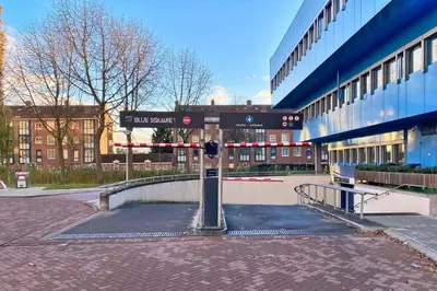 a street sign in front of a building at XO Hotels Blue Square in Amsterdam