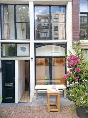 a building with a bench in front of it at New Apartment in the Heart of Amsterdam in Amsterdam