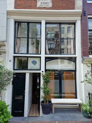 a building with a bench in front of it at New Apartment in the Heart of Amsterdam in Amsterdam