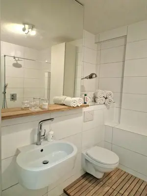 a white bathroom with a sink and a toilet at New Apartment in the Heart of Amsterdam in Amsterdam