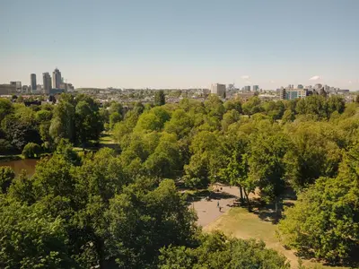 an aerial view of a park with a city in the background at Hotel V Oosterpark in Amsterdam