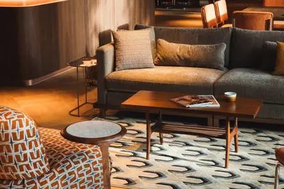 a living room with a couch and a coffee table at Hotel V Oosterpark in Amsterdam