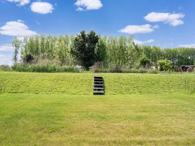a ladder in the middle of a grass field at Holiday Home in Oud Ade near Kaag Lakes in Oud-Ade