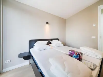 a bedroom with a bed with a picture on it at Holiday Home in Oud Ade near Kaag Lakes in Oud-Ade