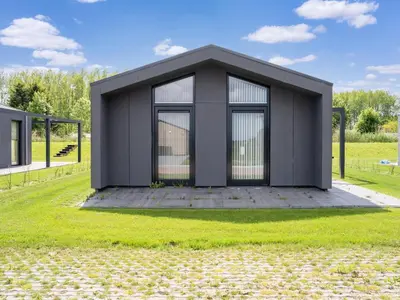 a rendering of a black house in a field at Holiday Home near Kaag Lakes and Leiden Canals in Oud-Ade