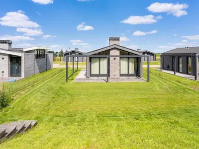 an image of a house with a green yard at Holiday Home near Kaag Lakes and Leiden Canals in Oud-Ade