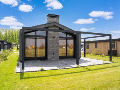a gazebo in a yard with grass at Holiday Home Oud Ade near Kaag Lakes in Oud-Ade