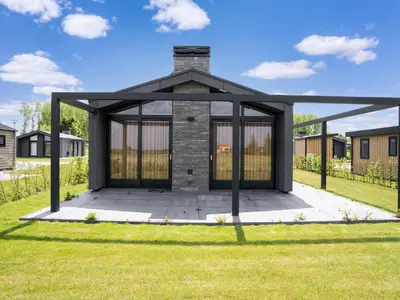 a gazebo in the middle of a yard at Holiday Home Oud Ade near Kaag Lakes in Oud-Ade