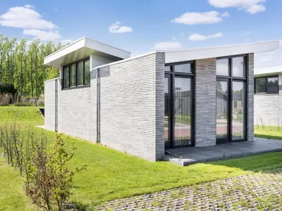 a house with a modern look with a yard at Holiday Home in Oud Ade near Kaag Lakes in Oud-Ade