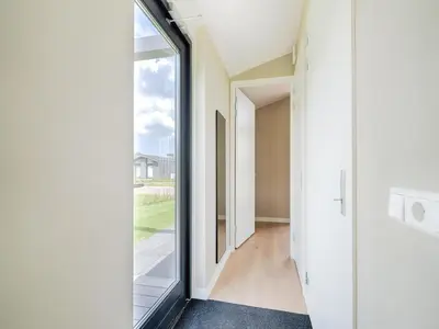 a room with a large window and a hallway at Holiday Home in Oud Ade near Kaag Lakes in Oud-Ade