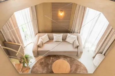 a living room with a couch and a table at Unique 3 floor apartment with AC at Westerpark in Amsterdam